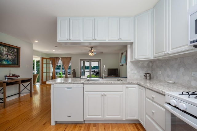 22869 W Lake Shore Dr, Antioch, IL 60002 - kitchen featuring white appliances, a peninsula, a ceiling fan, white cabinets, and light wood-style flooring
