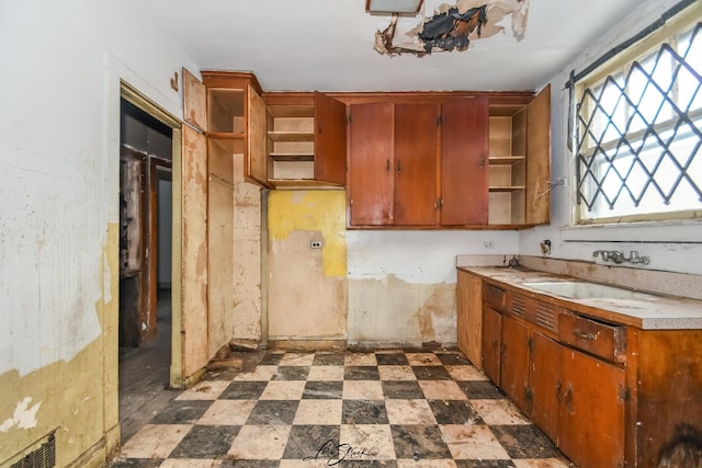 8645 S Bennett Ave, Chicago, IL 60617 - kitchen with open shelves, light countertops, and dark floors
