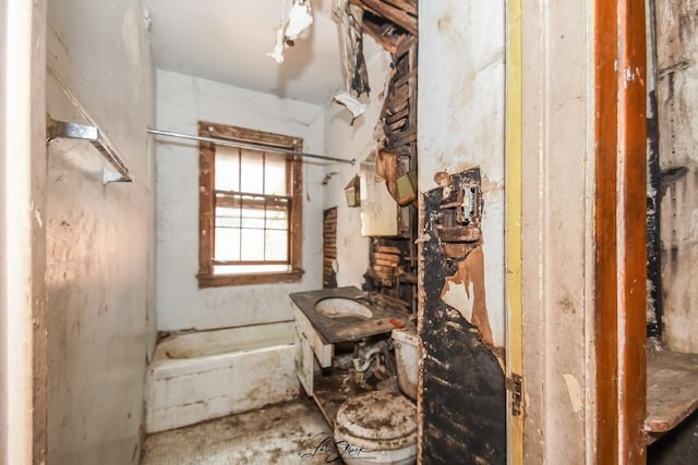 8645 S Bennett Ave, Chicago, IL 60617 - bathroom with a tub with marble appearance and a sink