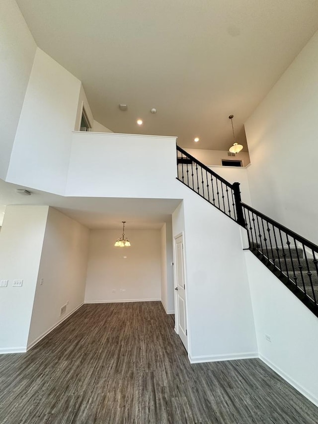 15041 W Quincy Cir, Manhattan, IL 60442 - staircase with wood finished floors, recessed lighting, a chandelier, and a towering ceiling