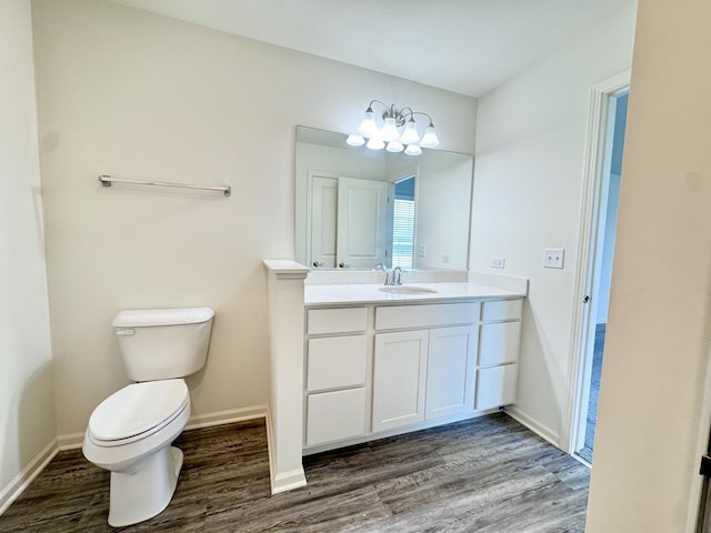 15041 W Quincy Cir, Manhattan, IL 60442 - bathroom with wood finished floors, vanity, and a chandelier