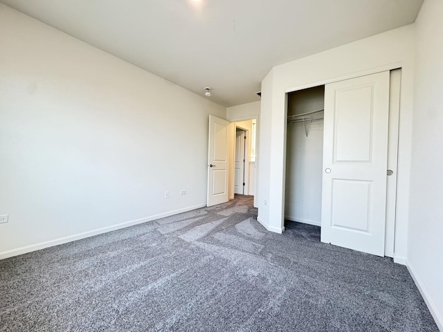 15041 W Quincy Cir, Manhattan, IL 60442 - unfurnished bedroom featuring dark carpet and a closet