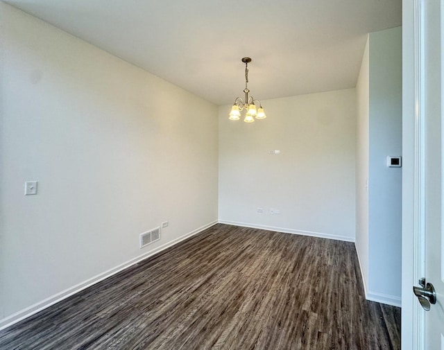 15041 W Quincy Cir, Manhattan, IL 60442 - empty room with dark wood-type flooring and a chandelier