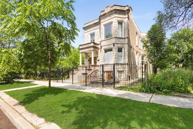 1643 S Millard Ave, Chicago, IL 60623 - italianate home with stone siding and a fenced front yard