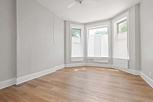 1643 S Millard Ave, Chicago, IL 60623 - unfurnished room with plenty of natural light, light wood-type flooring, and a ceiling fan