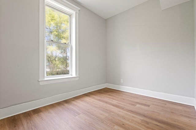 1643 S Millard Ave, Chicago, IL 60623 - spare room featuring lofted ceiling and light wood-style floors