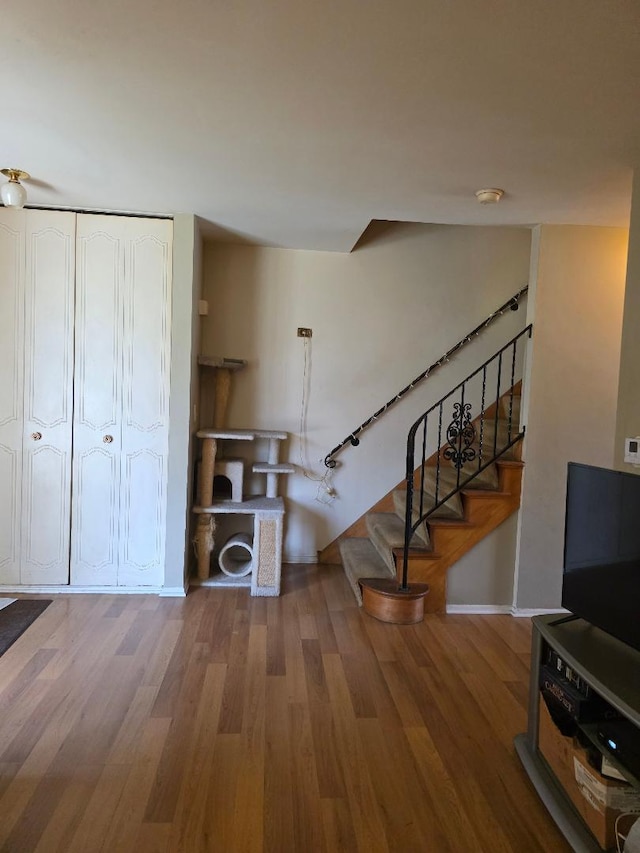 264 Bay St, Wood Dale, IL 60191 - unfurnished living room featuring wood finished floors and stairway