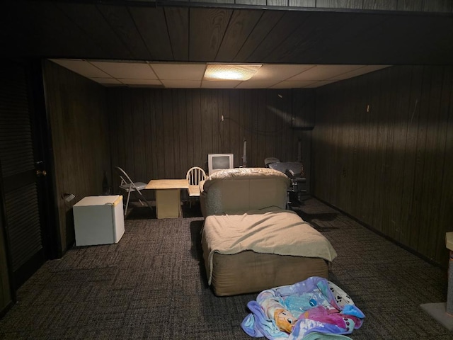 264 Bay St, Wood Dale, IL 60191 - carpeted bedroom featuring wood walls, a paneled ceiling, and an office area