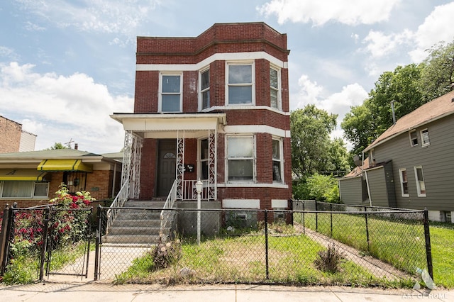 1229 E 71st St, Chicago, IL 60619 - view of front facade with brick siding, a fenced front yard, a gate, and covered porch