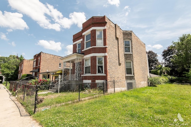 1229 E 71st St, Chicago, IL 60619 - view of property with a fenced front yard