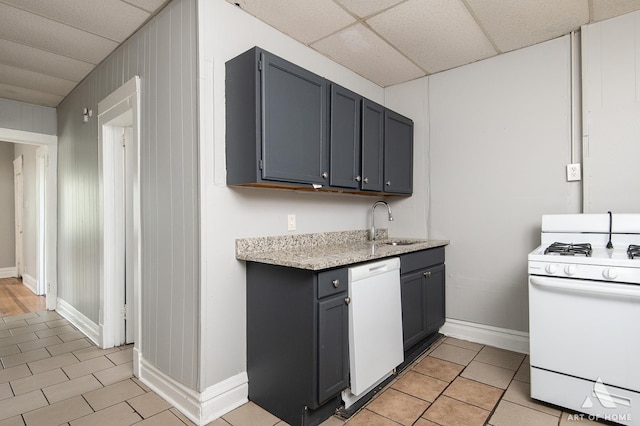 1229 E 71st St, Chicago, IL 60619 - kitchen featuring white appliances, light tile patterned floors, a paneled ceiling, gray cabinetry, and light stone countertops