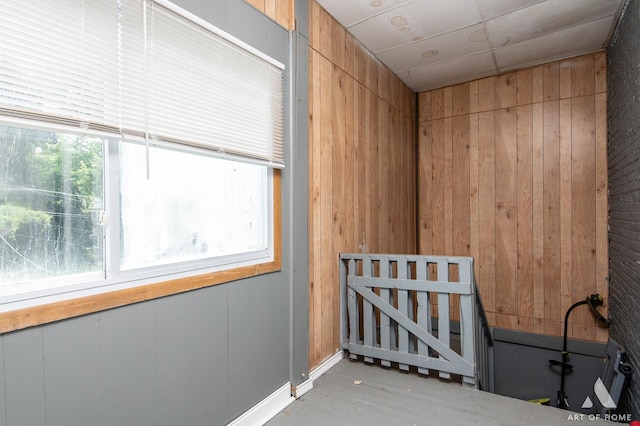 1229 E 71st St, Chicago, IL 60619 - empty room featuring healthy amount of natural light and wood walls