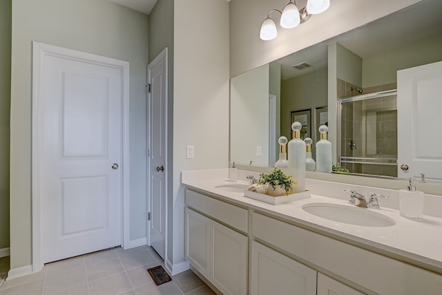 1647 Patterson Ave, North Aurora, IL 60542 - full bathroom featuring double vanity, a tile shower, and tile patterned flooring