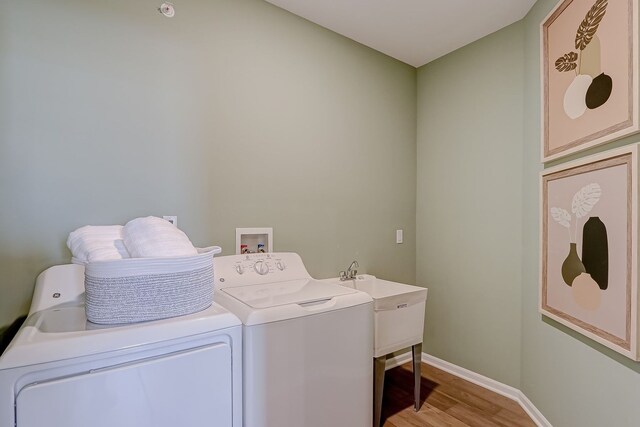 1647 Patterson Ave, North Aurora, IL 60542 - washroom featuring washer and dryer, light wood-type flooring, and cabinet space