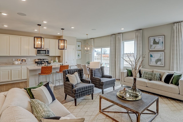 1647 Patterson Ave, North Aurora, IL 60542 - living area with a chandelier, recessed lighting, and light wood finished floors