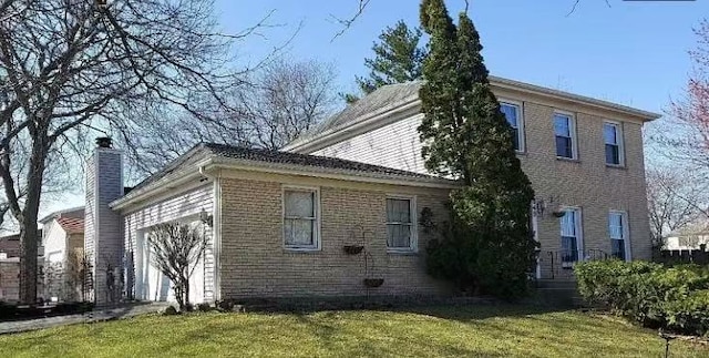 848 Birchbark Trl, Carol Stream, IL 60188 - view of home's exterior featuring an attached garage, brick siding, a lawn, and a chimney