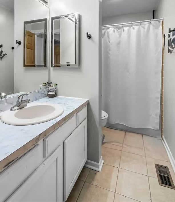 848 Birchbark Trl, Carol Stream, IL 60188 - bathroom featuring vanity, tile patterned floors, and a shower with shower curtain