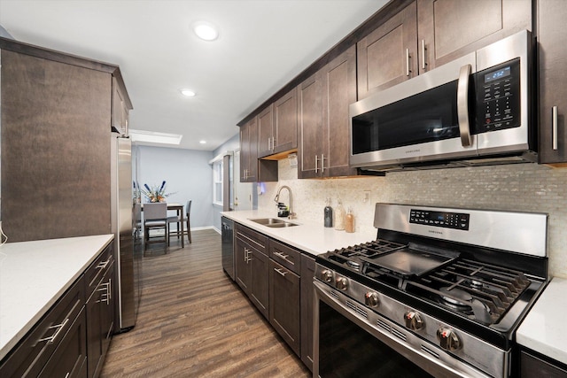 1033 W Indiana St, Glenwood, IL 60425 - kitchen featuring stainless steel appliances, dark brown cabinetry, dark wood-type flooring, tasteful backsplash, and recessed lighting