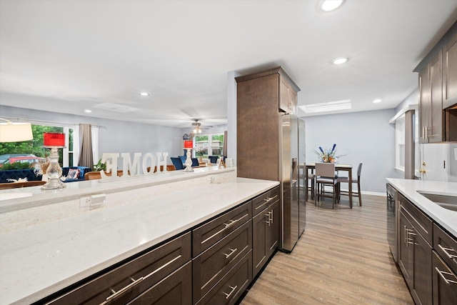 1033 W Indiana St, Glenwood, IL 60425 - kitchen with appliances with stainless steel finishes, light wood-style flooring, plenty of natural light, recessed lighting, and a ceiling fan