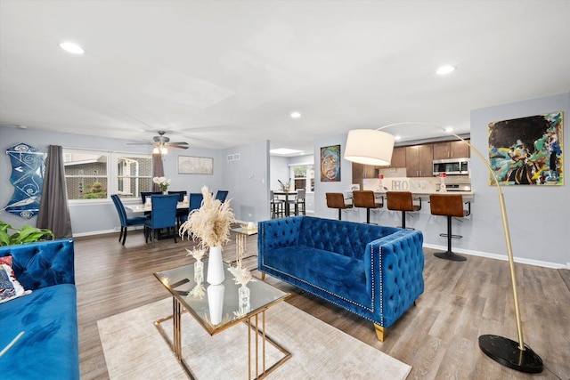 1033 W Indiana St, Glenwood, IL 60425 - living area featuring wood finished floors, plenty of natural light, recessed lighting, and ceiling fan