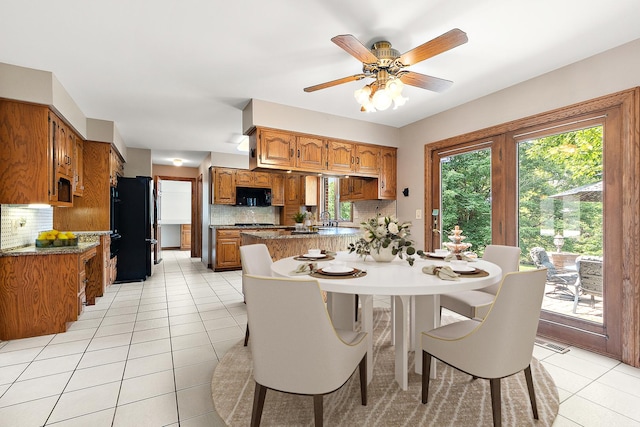 21978 Princeton Cir, Frankfort, IL 60423 - dining room with light tile patterned floors, healthy amount of natural light, and a ceiling fan