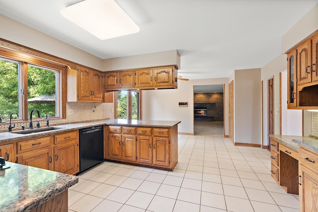 21978 Princeton Cir, Frankfort, IL 60423 - kitchen featuring a peninsula, healthy amount of natural light, and brown cabinetry