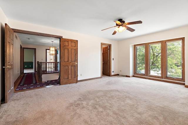 21978 Princeton Cir, Frankfort, IL 60423 - unfurnished room with carpet flooring, a ceiling fan, and a chandelier