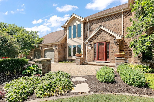 21978 Princeton Cir, Frankfort, IL 60423 - view of front of home with an attached garage, brick siding, and roof with shingles