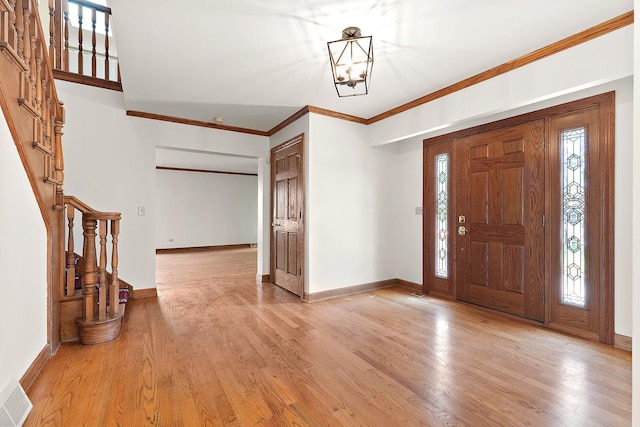 21978 Princeton Cir, Frankfort, IL 60423 - entryway featuring stairway, light wood finished floors, a chandelier, and ornamental molding