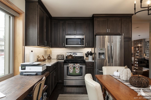 6928 Pershing Rd, Berwyn, IL 60402 - kitchen with appliances with stainless steel finishes, light countertops, plenty of natural light, and decorative backsplash