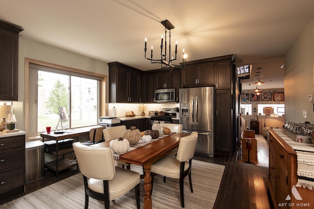 6928 Pershing Rd, Berwyn, IL 60402 - dining area with a chandelier and light wood-style floors