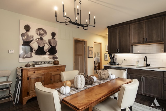6928 Pershing Rd, Berwyn, IL 60402 - dining area with a chandelier and dark wood-style floors
