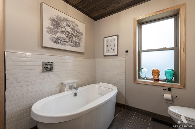 6928 Pershing Rd, Berwyn, IL 60402 - full bathroom featuring wood ceiling, a freestanding tub, tile patterned flooring, and tile walls