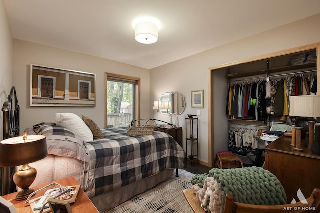 6928 Pershing Rd, Berwyn, IL 60402 - bedroom featuring a closet and wood finished floors