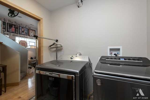 6928 Pershing Rd, Berwyn, IL 60402 - laundry room with washing machine and dryer and light wood-style floors