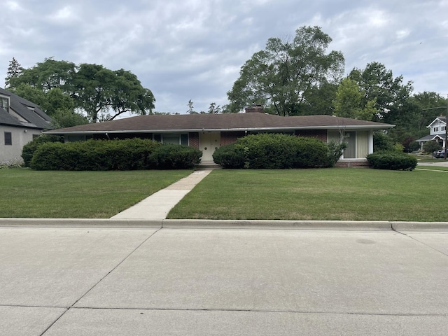 3900 Clausen Ave, Western Springs, IL 60558 - ranch-style house featuring a front yard, a chimney, and brick siding