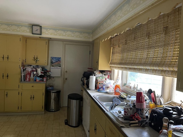 3900 Clausen Ave, Western Springs, IL 60558 - kitchen with cream cabinets, wallpapered walls, light countertops, light floors, and white dishwasher