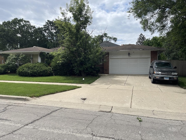 3900 Clausen Ave, Western Springs, IL 60558 - view of front facade with concrete driveway, a front lawn, brick siding, and a garage