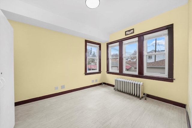 5019 N Kostner Ave, Chicago, IL 60630 - unfurnished room with radiator heating unit and light wood-type flooring