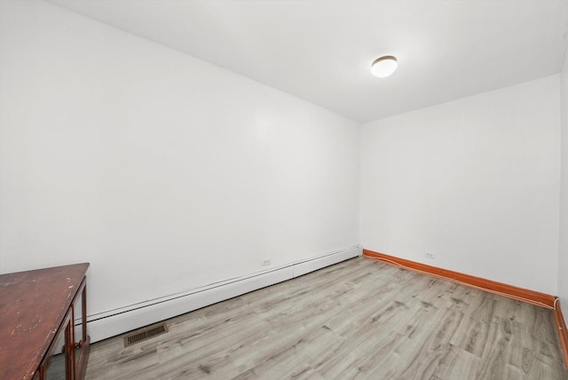 5019 N Kostner Ave, Chicago, IL 60630 - spare room with wood finished floors and baseboard heating