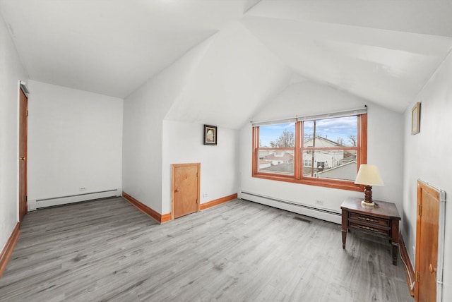 5019 N Kostner Ave, Chicago, IL 60630 - additional living space with a baseboard heating unit, a baseboard radiator, light wood finished floors, and vaulted ceiling
