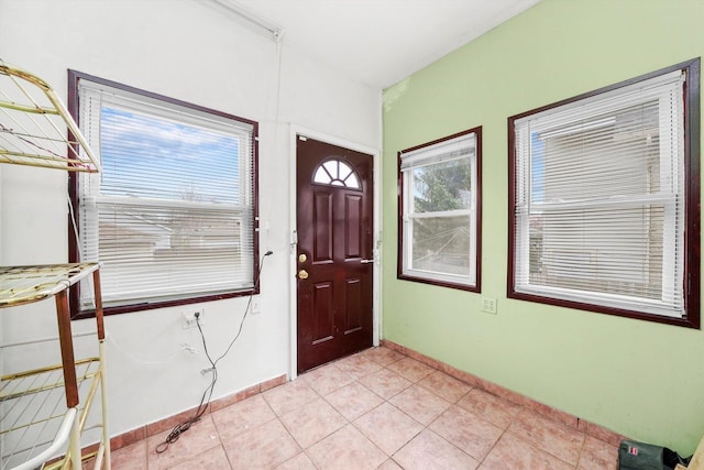 5019 N Kostner Ave, Chicago, IL 60630 - foyer featuring light tile patterned floors and baseboards