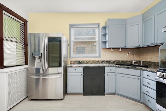 5019 N Kostner Ave, Chicago, IL 60630 - kitchen featuring stainless steel refrigerator with ice dispenser, wall oven, healthy amount of natural light, and decorative backsplash