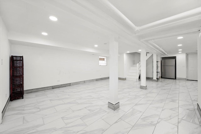 5019 N Kostner Ave, Chicago, IL 60630 - basement featuring freestanding refrigerator, recessed lighting, stairway, and light marble finish floors