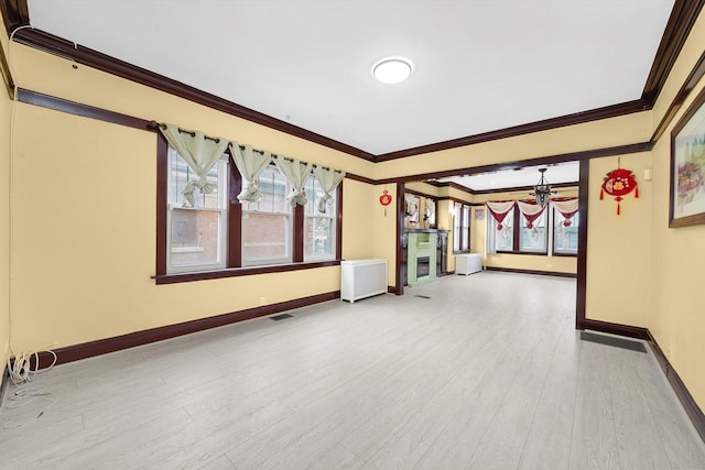 5019 N Kostner Ave, Chicago, IL 60630 - spare room with ornamental molding, a chandelier, and wood finished floors