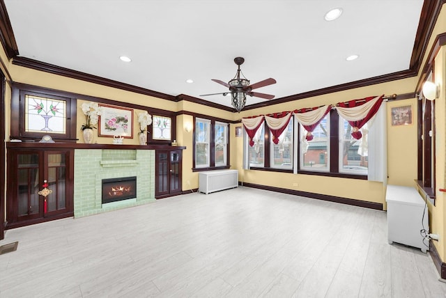 5019 N Kostner Ave, Chicago, IL 60630 - unfurnished living room with crown molding, a ceiling fan, wood finished floors, a fireplace, and recessed lighting