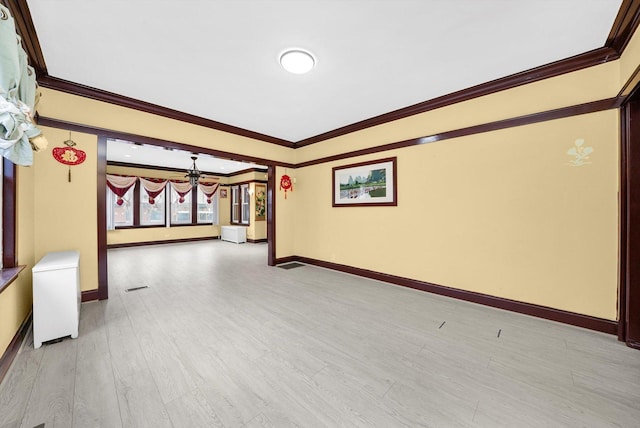 5019 N Kostner Ave, Chicago, IL 60630 - empty room with a chandelier, crown molding, and light wood finished floors