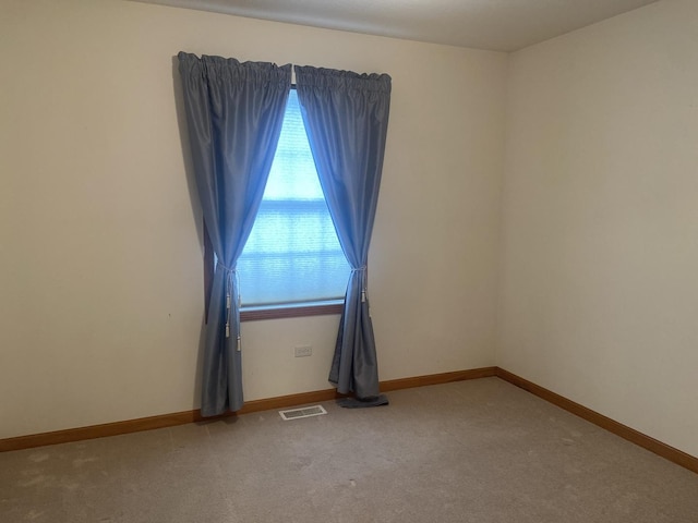 831 Oriole Dr, Peotone, IL 60468 - empty room with light colored carpet and baseboards