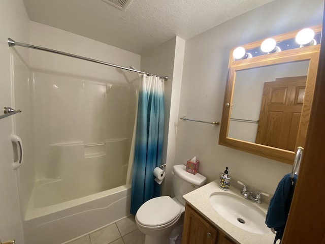 831 Oriole Dr, Peotone, IL 60468 - bathroom featuring tile patterned flooring, vanity, shower / tub combo, and a textured ceiling