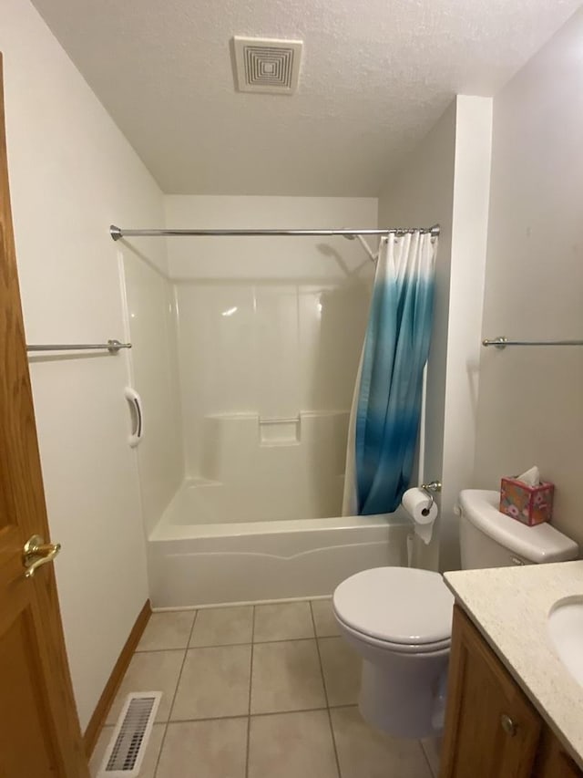 831 Oriole Dr, Peotone, IL 60468 - bathroom with shower / bath combination with curtain, tile patterned flooring, vanity, and a textured ceiling